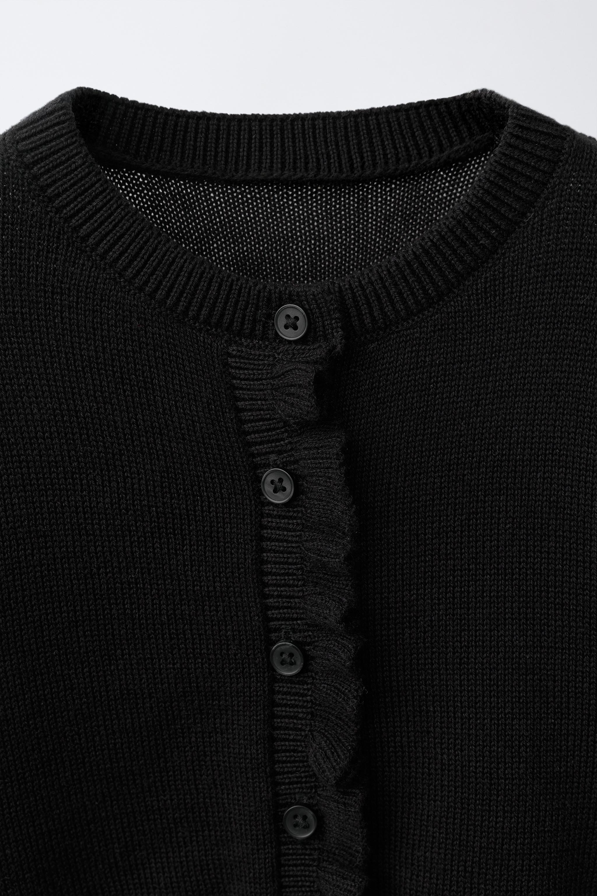 GILET EN MAILLE À PETIT VOLANT